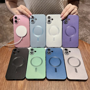 Set of eight phone cases in various colors on a wooden surface.