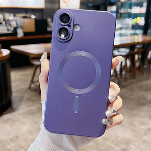 Person holding a purple phone case with a magnetic design in a blurred indoor setting