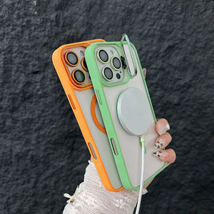 iPhone case with a stand feature held by a hand against a dark textured background