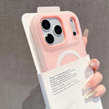 Pink phone case held by a hand with a gray background