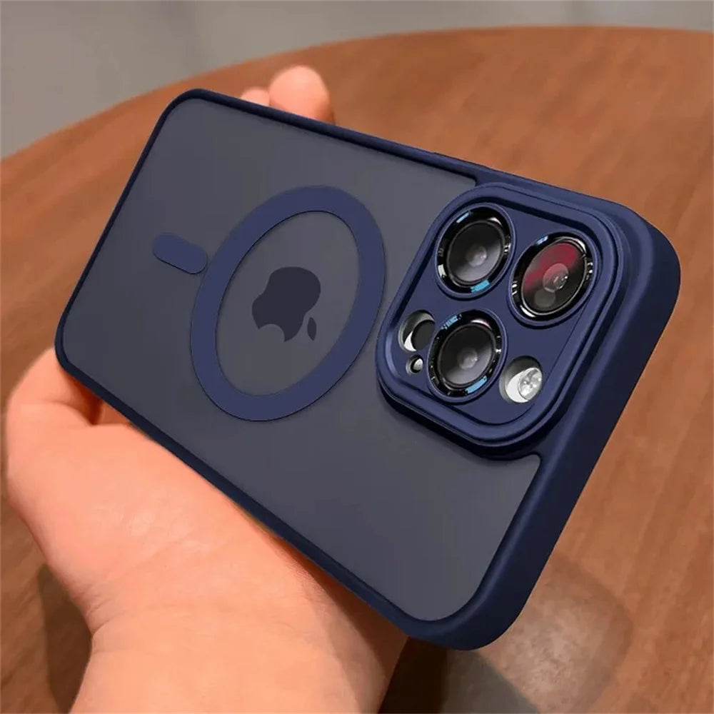 Navy blue Matte translucent magnetic iPhone case with camera lens protection and MagSafe held by a hand on a wooden surface