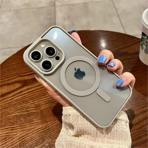 Person holding a Clear magnetic iPhone case compatible with MagSafe wireless charging on a wooden table