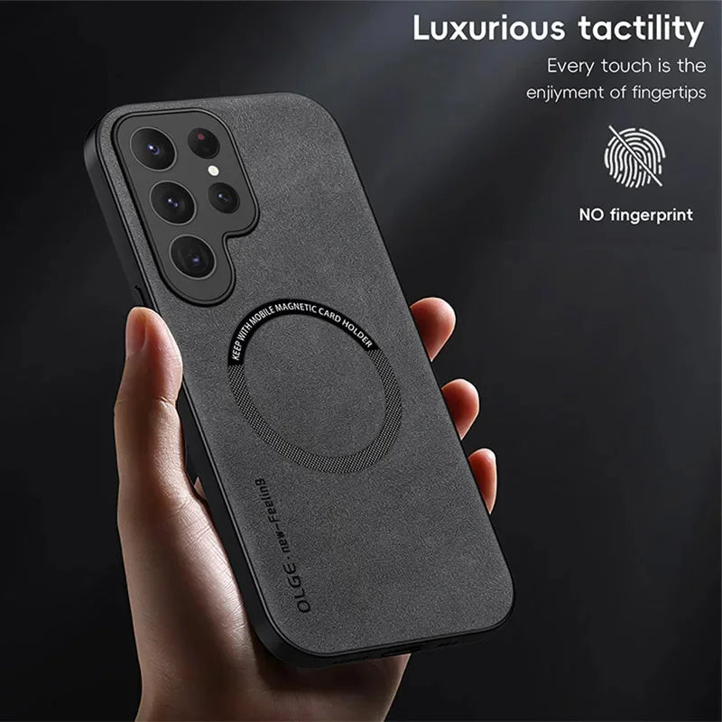Black phone case with fingerprint prevention feature held by a hand on a dark background
