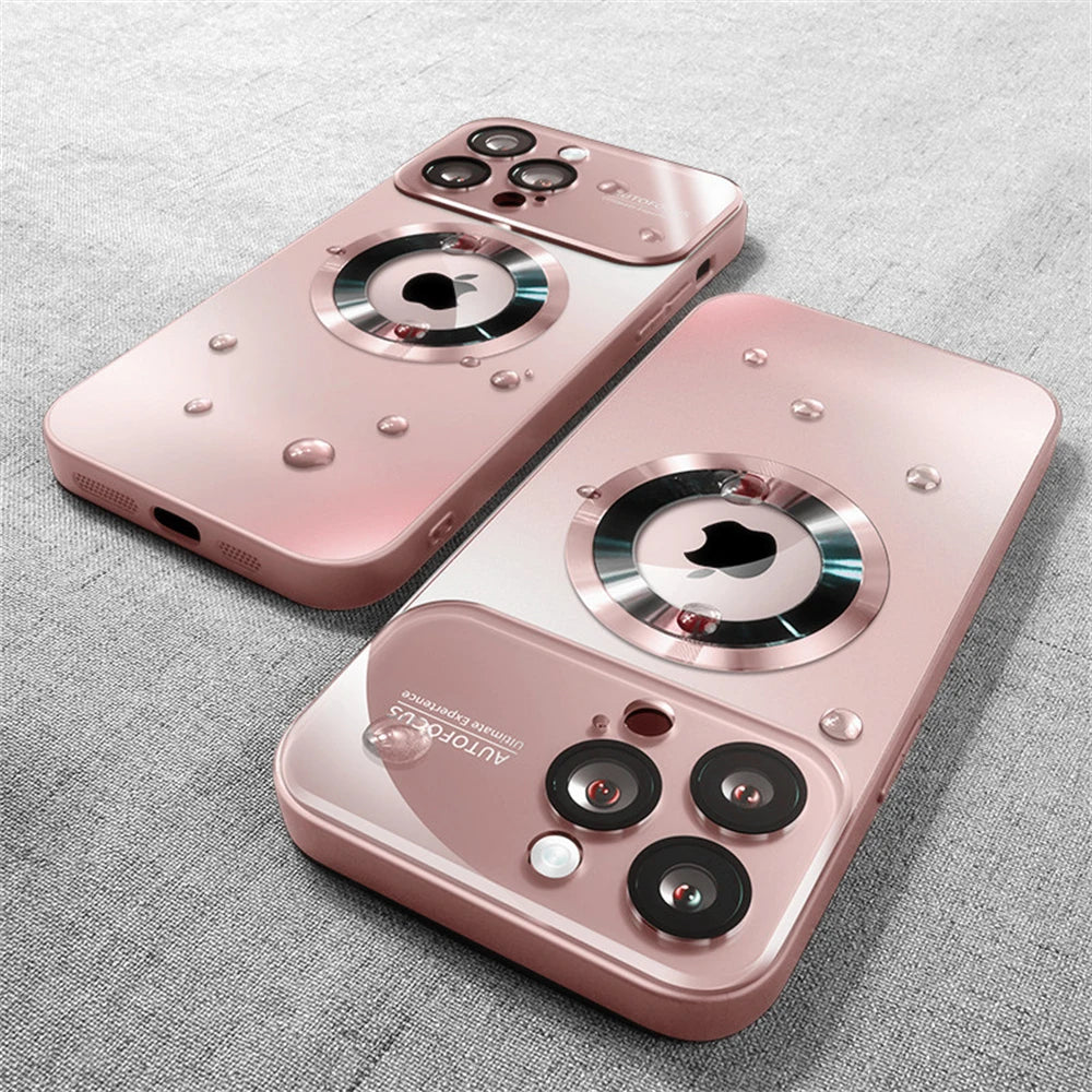 Two pink phone cases with a unique design on a gray fabric background