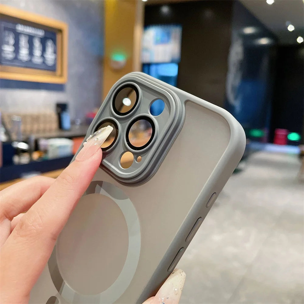 Phone case with camera lens protector held by a hand in an indoor setting