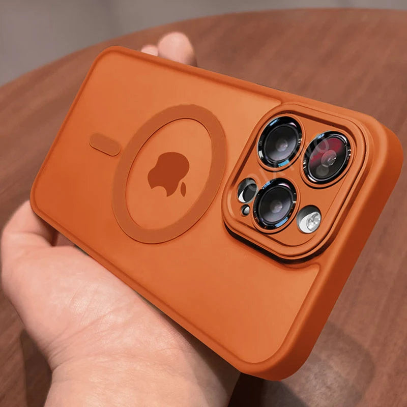 Orange Matte magnetic iPhone case compatible with Magsafe wireless charging held by a hand on a wooden surface